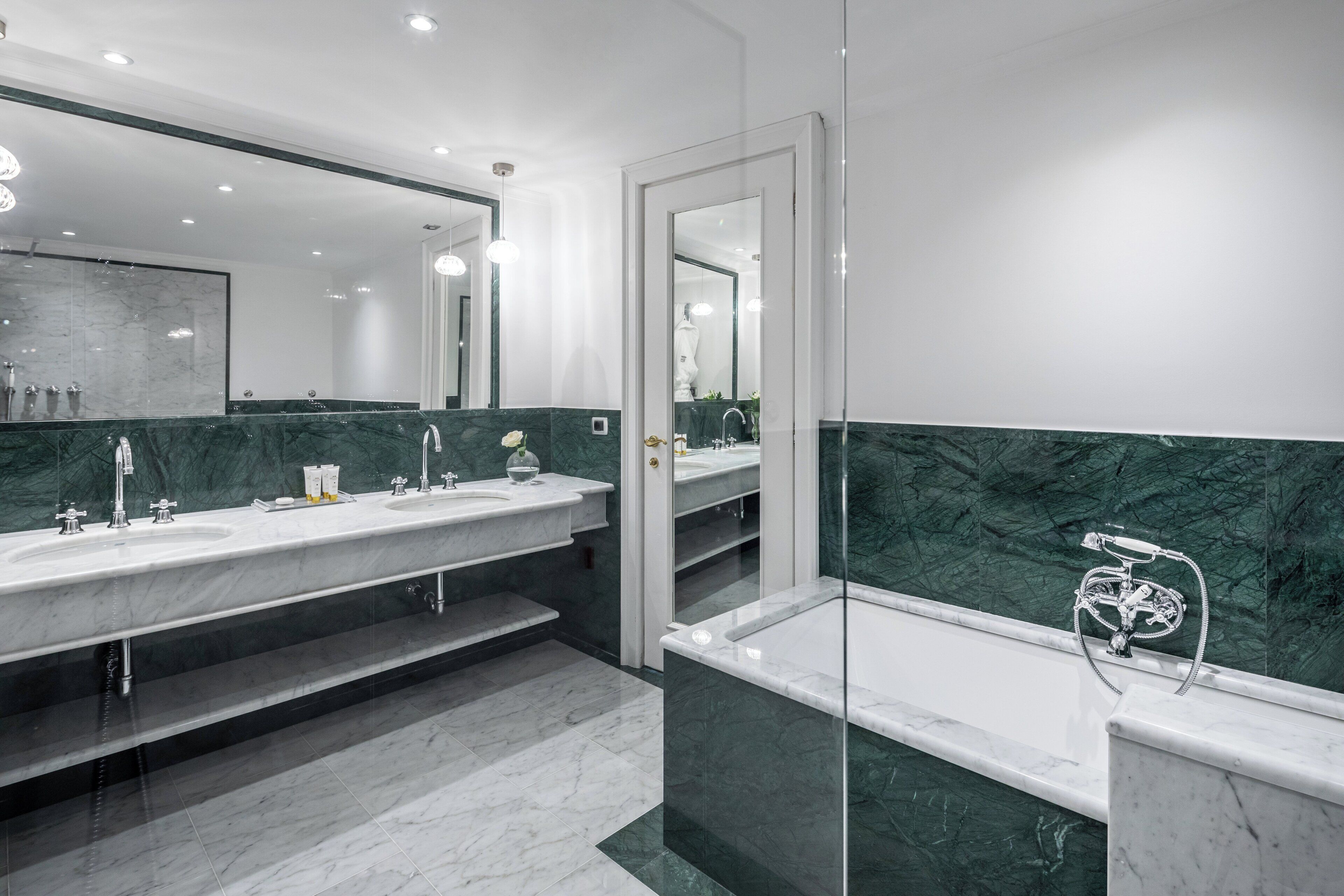 Designer toiletries, hair dryer, bathrobes, slippers