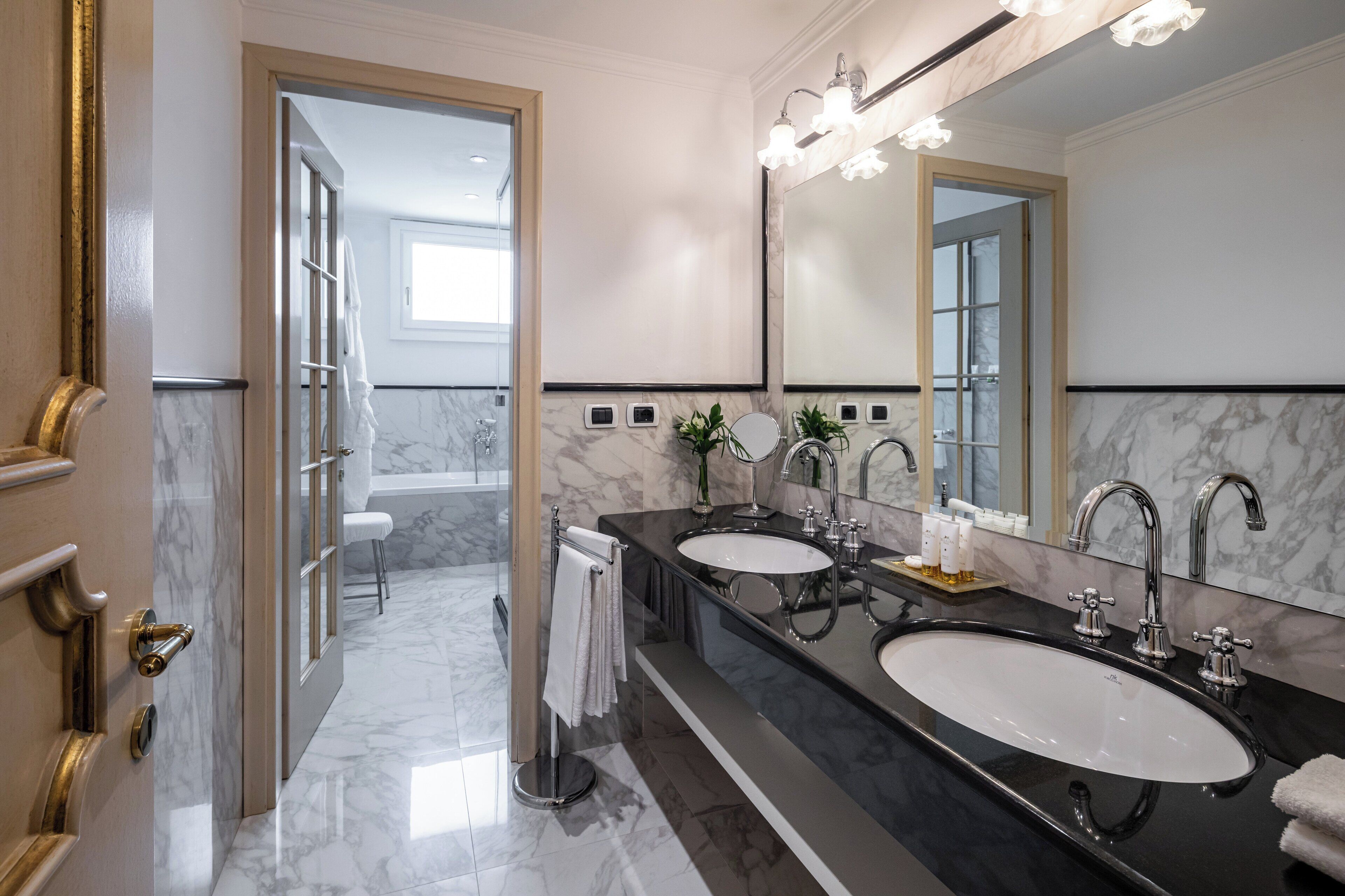 designer toiletries, hair dryer, bathrobes, slippers