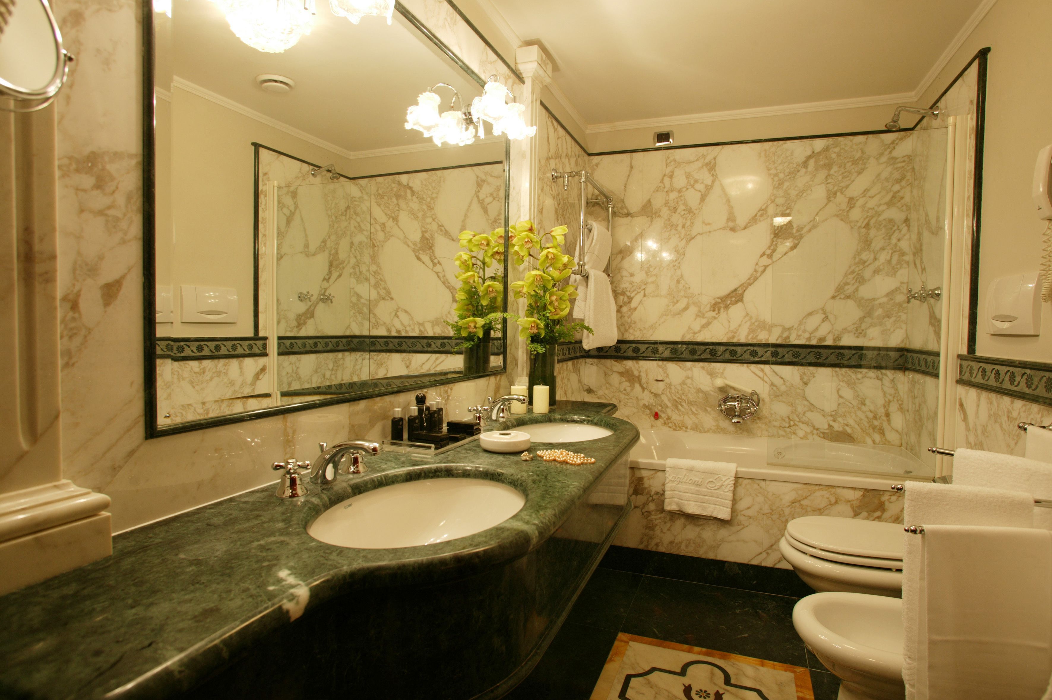 Designer toiletries, hair dryer, bathrobes, slippers