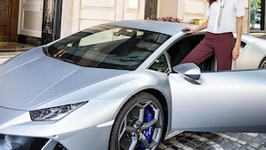 A silver sports car parked in front of a building with a sign reading "Gina Hotel Baglioni." - Baglioni Hotel Regina - The Leading Hotels of the World (Rome)