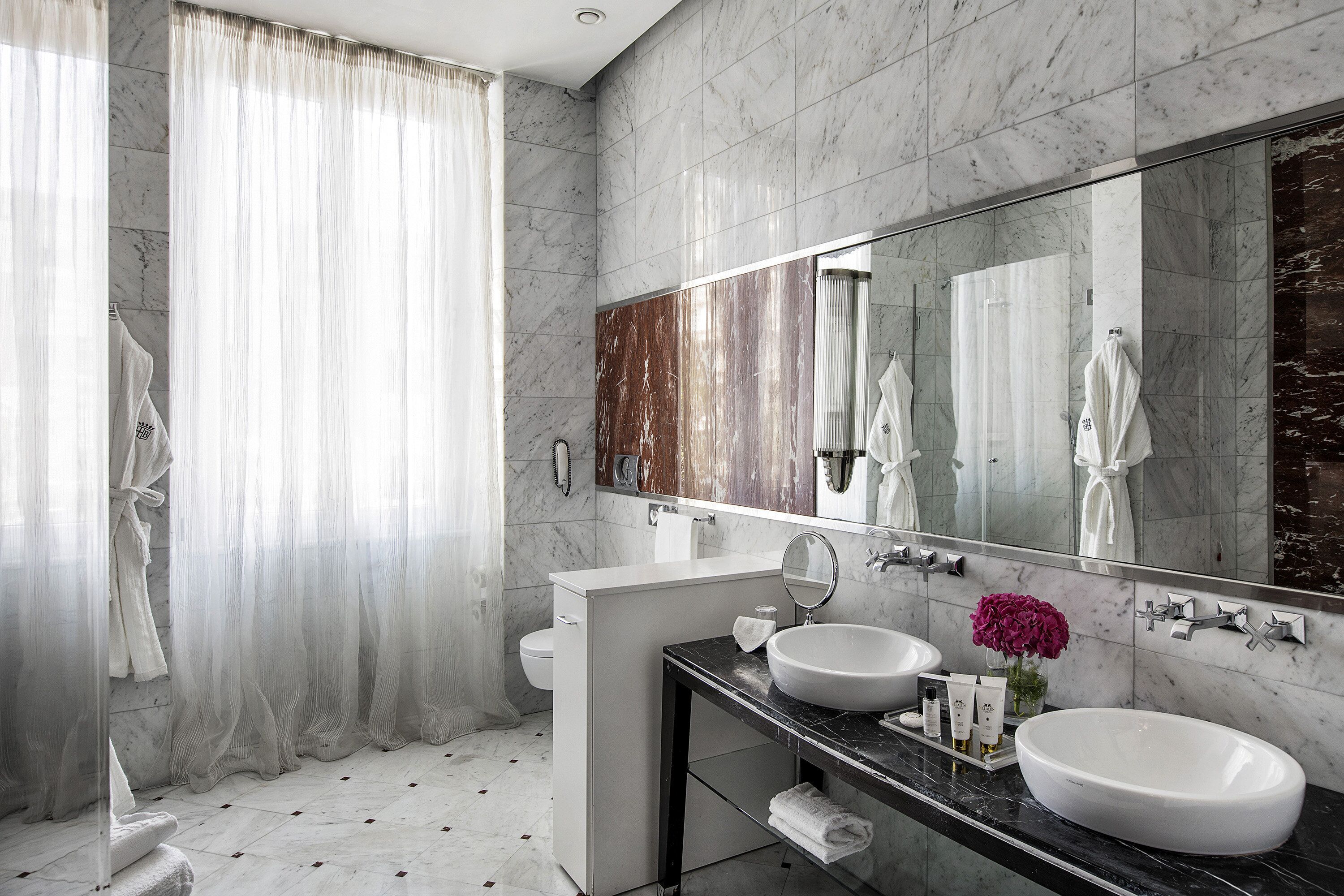 Dolce Vita Suite | Bathroom | Rainfall showerhead, designer toiletries, hair dryer, bathrobes