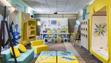 Children can play and learn in this colorful play area with toys, educational materials, and seating options.