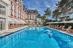 Indoor pool, seasonal outdoor pool, pool umbrellas, pool loungers