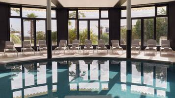 Indoor pool, seasonal outdoor pool, pool umbrellas, pool loungers