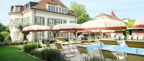 Seasonal outdoor pool, open 8:00 AM to 8:00 PM, pool umbrellas