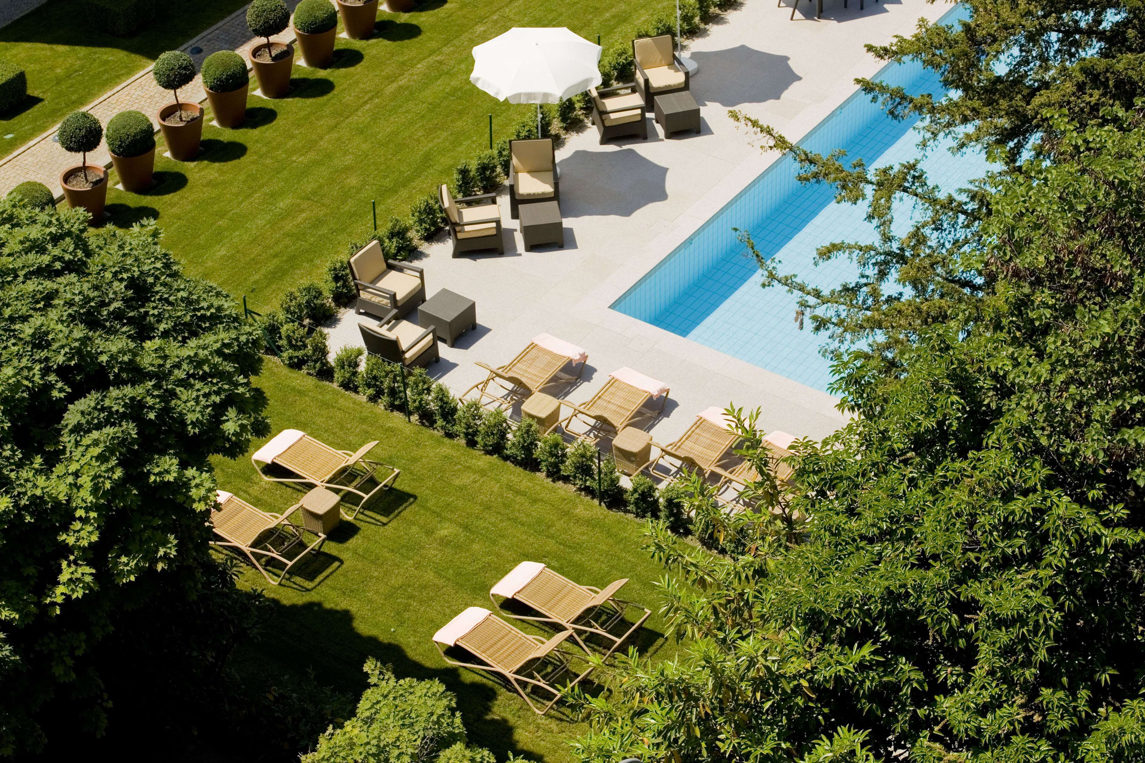 seasonal outdoor pool, open 8:00 am to 8:00 pm, pool umbrellas