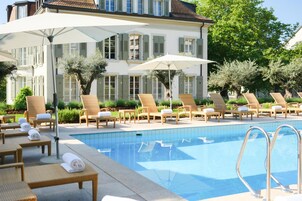 Seasonal outdoor pool, open 8:00 AM to 8:00 PM, pool umbrellas