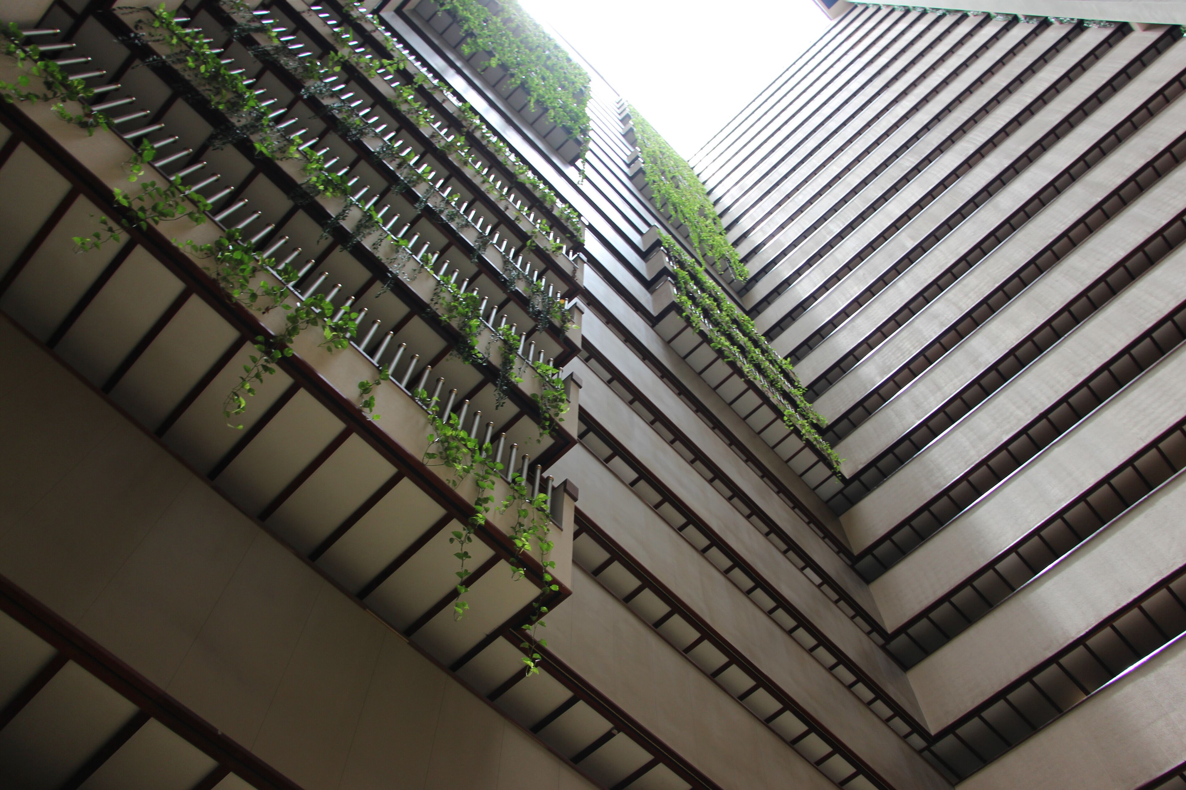 A high-rise building with multiple floors, featuring a modern architectural design with clean lines and a neutral color palette.