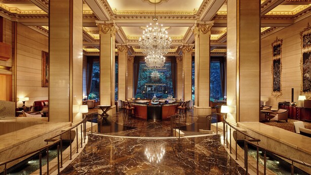 A luxurious lobby with marble flooring, a grand chandelier, and a central bar area. -  THE GRAND LOTTE SEOUL (Formerly: Lotte Hotel Seoul) (Seoul)
