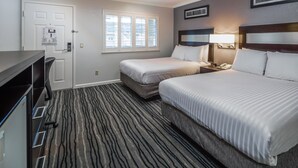 A hotel room with two beds, a desk, a chair, a window with blinds, and a door with a lock. - Redwood Creek Inn (Redwood City)