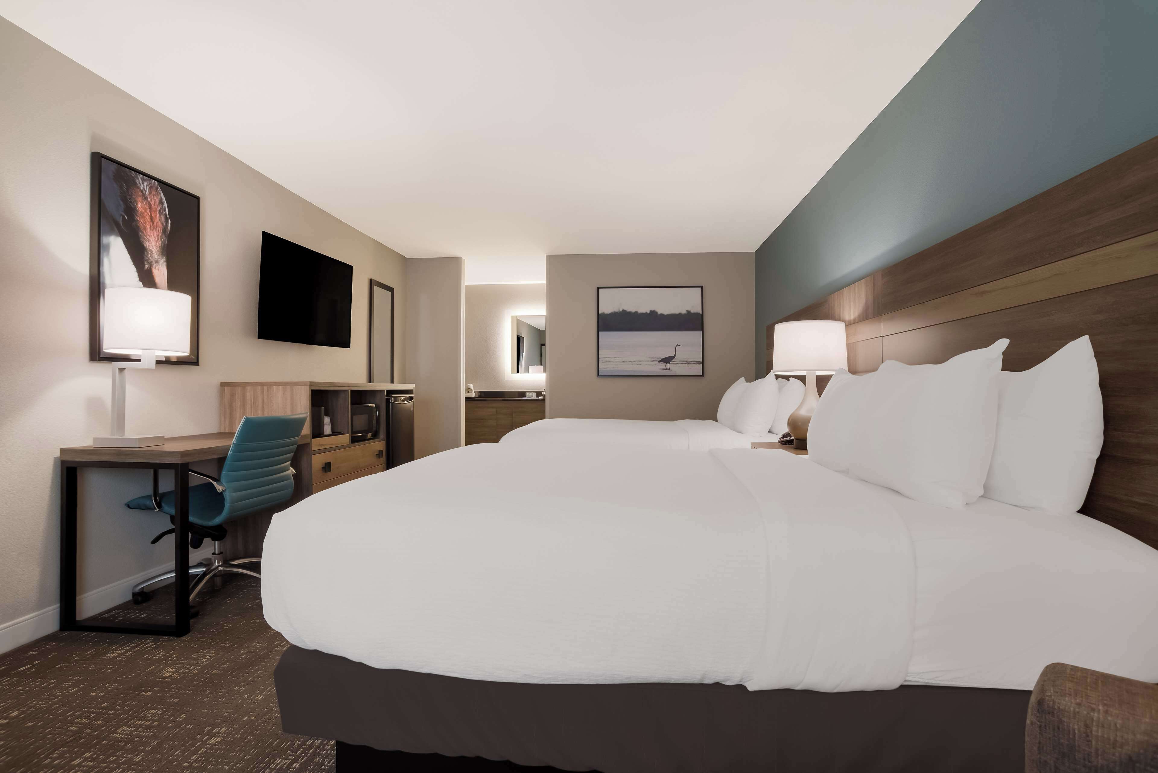 standard room, 2 queen beds, non smoking, refrigerator & microwave | 1 bedroom, in-room safe, desk, blackout curtains