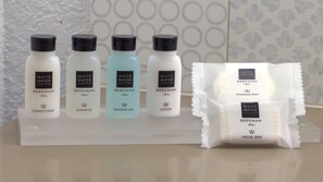 A display of White Water Collection products including conditioner, shampoo, shower gel, and lotion.