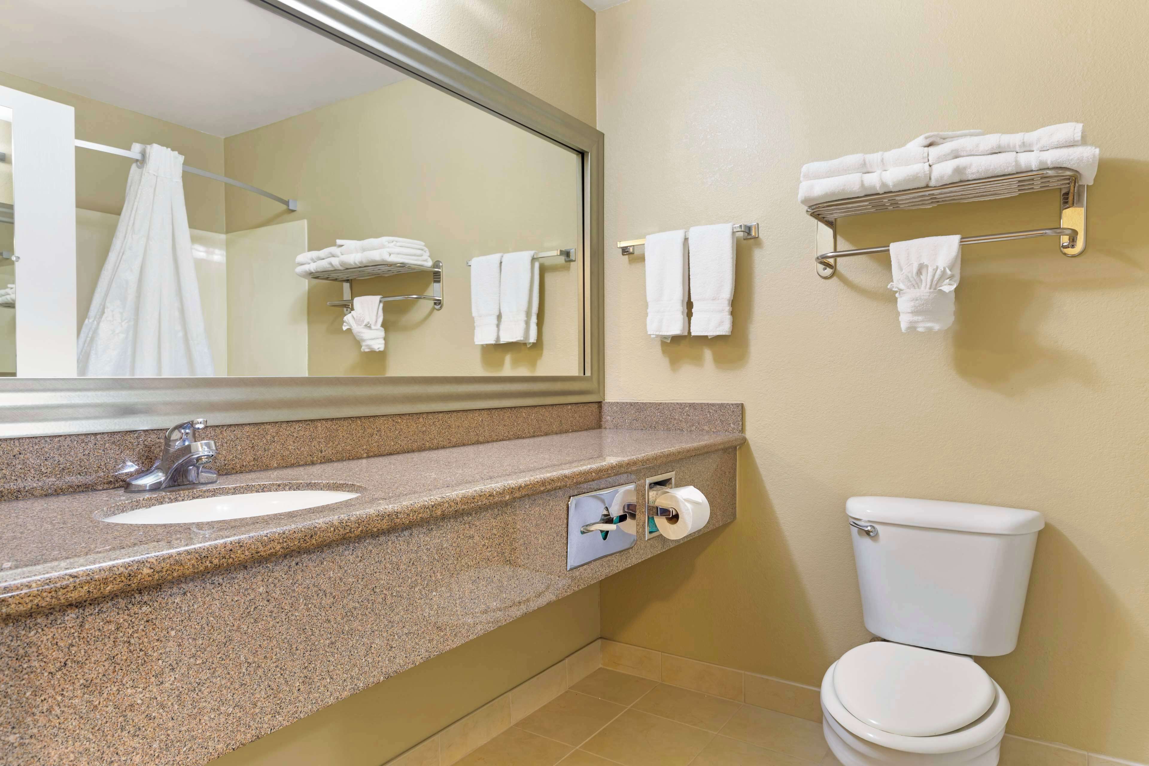 standard room, 2 queen beds, non smoking, refrigerator & microwave | bathroom | combined shower/bathtub, free toiletries, hair dryer, towels