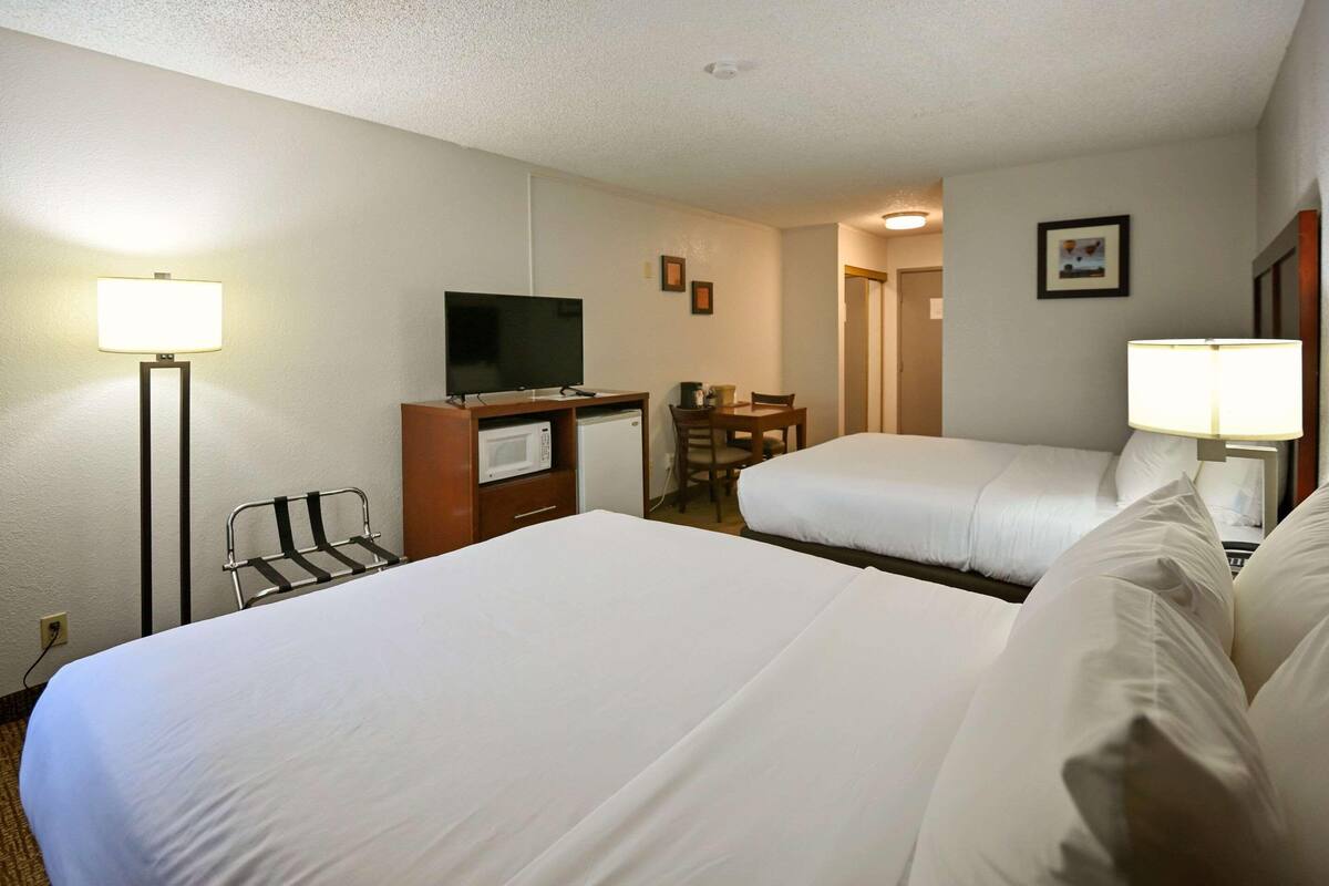 Premium bedding, desk, laptop workspace, blackout curtains