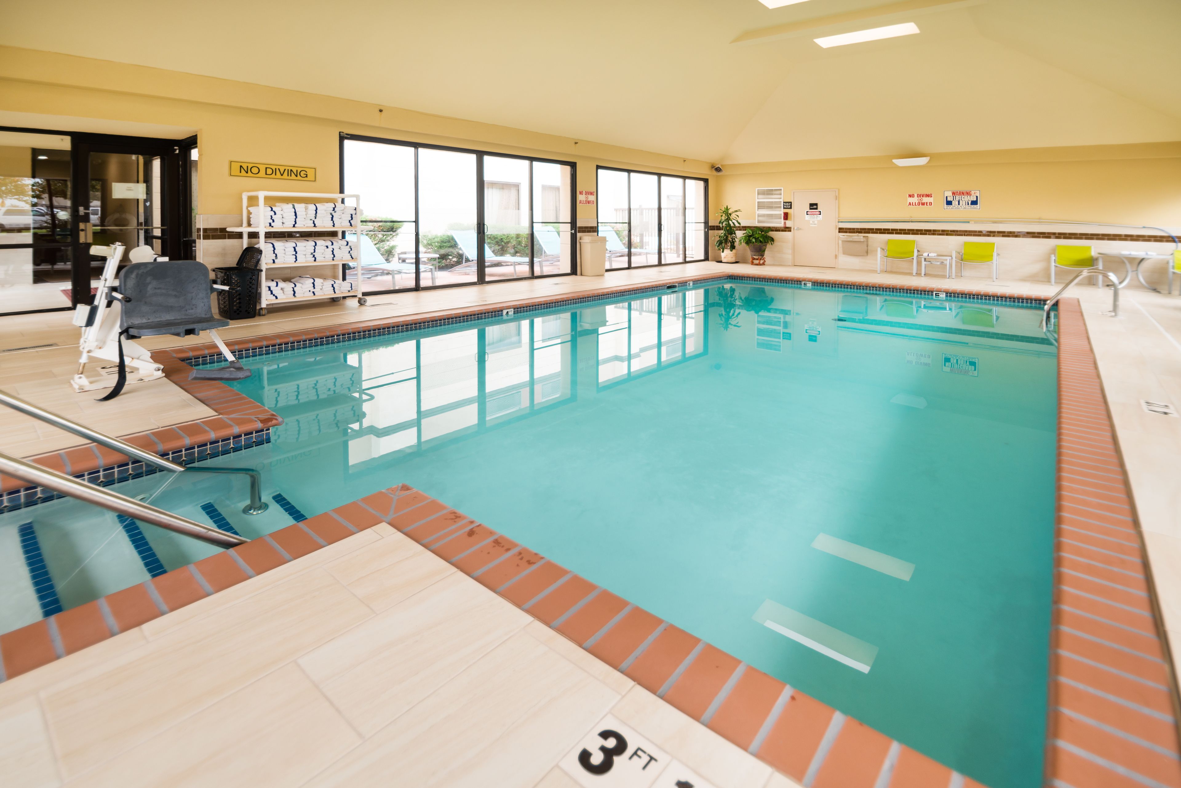 indoor pool, open 9:00 am to 10:00 am, pool loungers