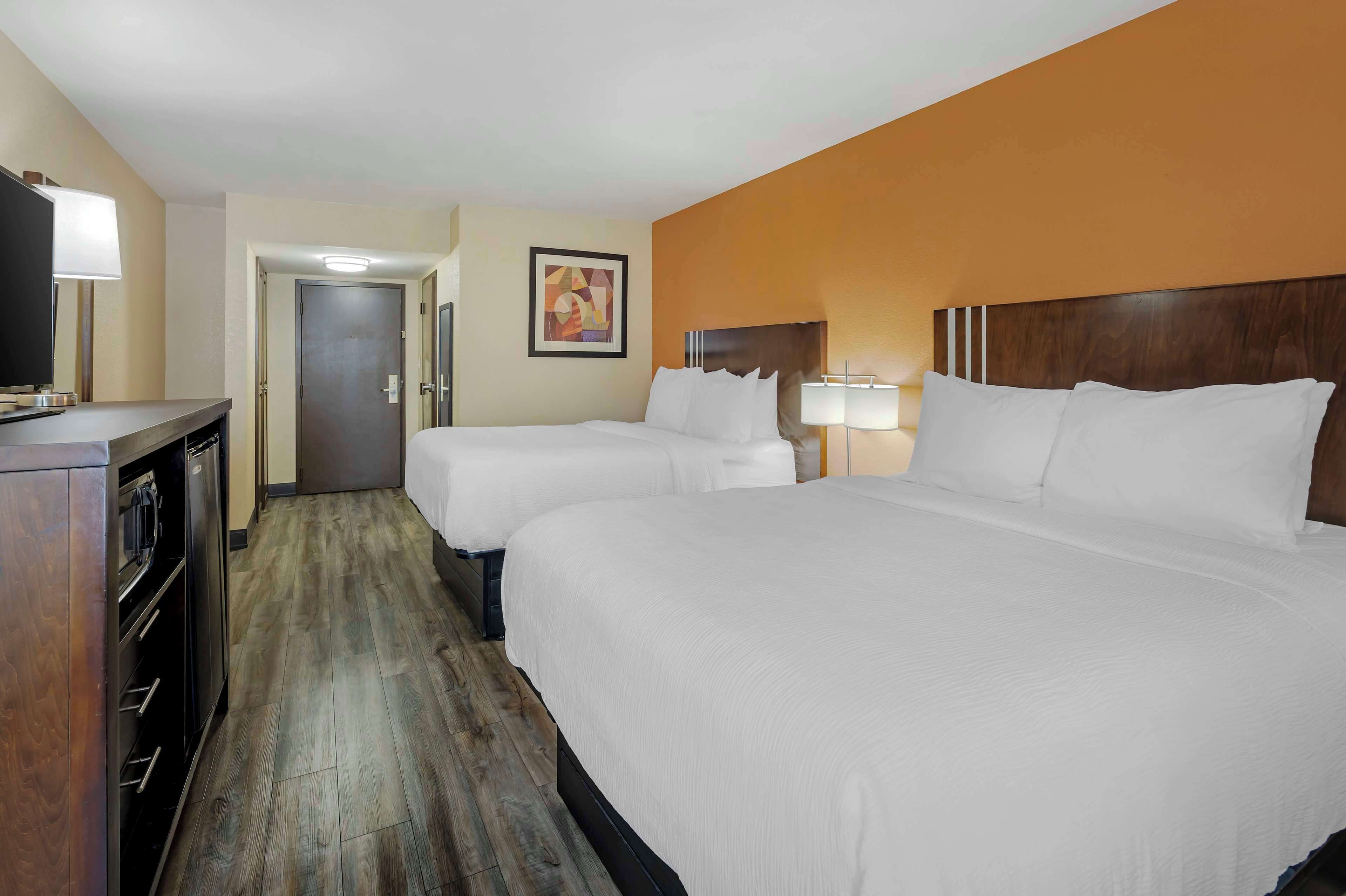 standard room, 2 queen beds, non smoking, refrigerator & microwave | down duvets, select comfort beds, in-room safe, laptop workspace