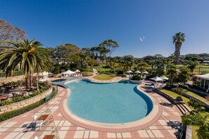 Outdoor pool, open 7:00 AM to 7:00 PM, pool umbrellas, sun loungers