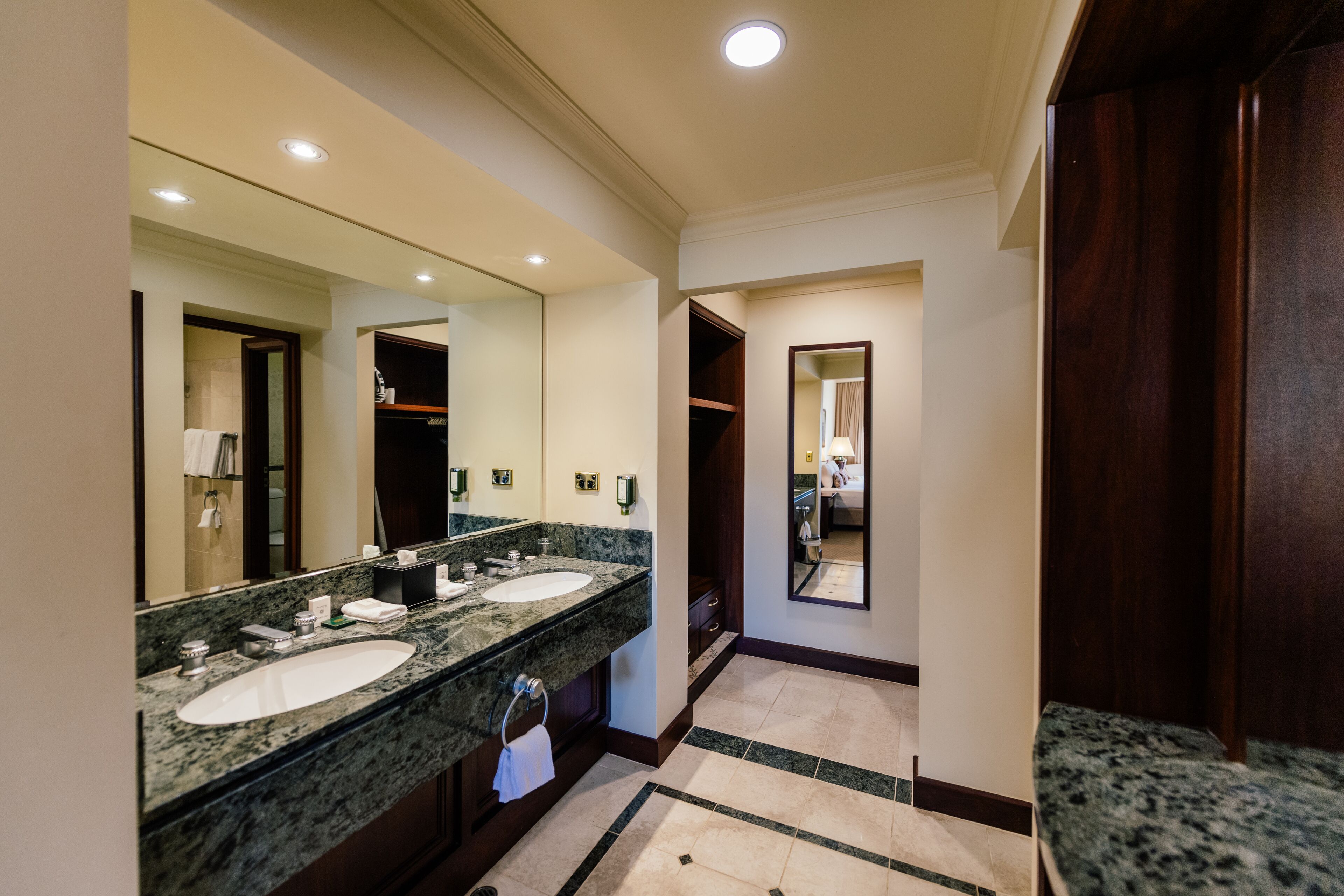 king suite | bathroom | hair dryer, slippers, towels