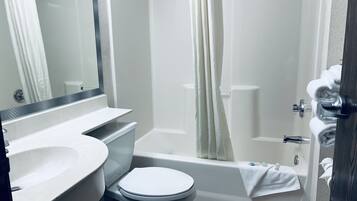 Suite, 1 Queen Bed | Bathroom | Combined shower/tub, free toiletries, hair dryer, towels