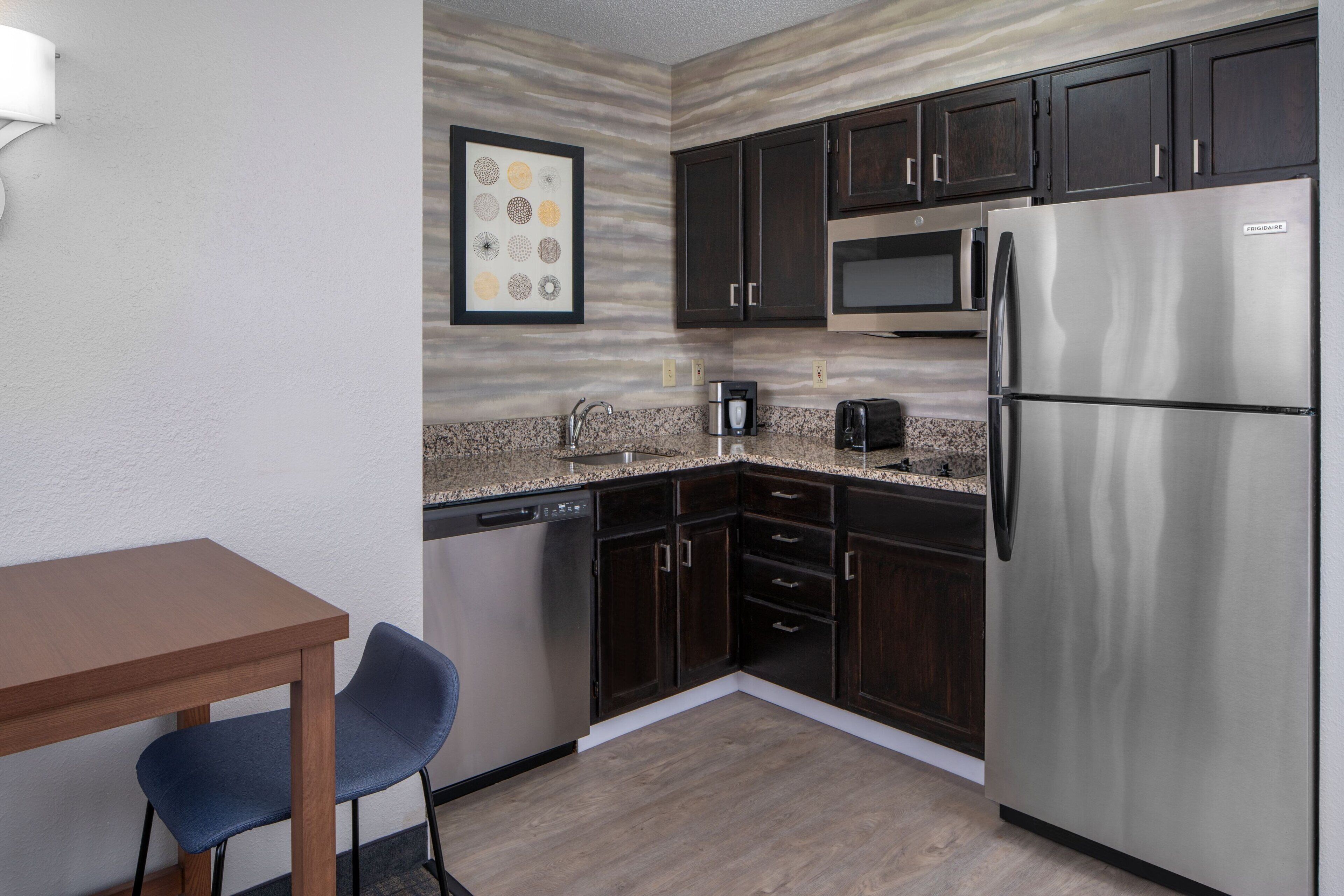 full-sized fridge, microwave, stovetop, dishwasher