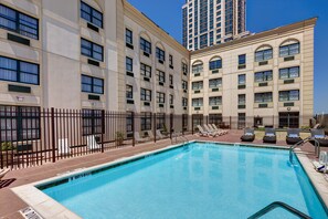 Seasonal outdoor pool, open 9 AM to 7:00 PM, pool loungers
