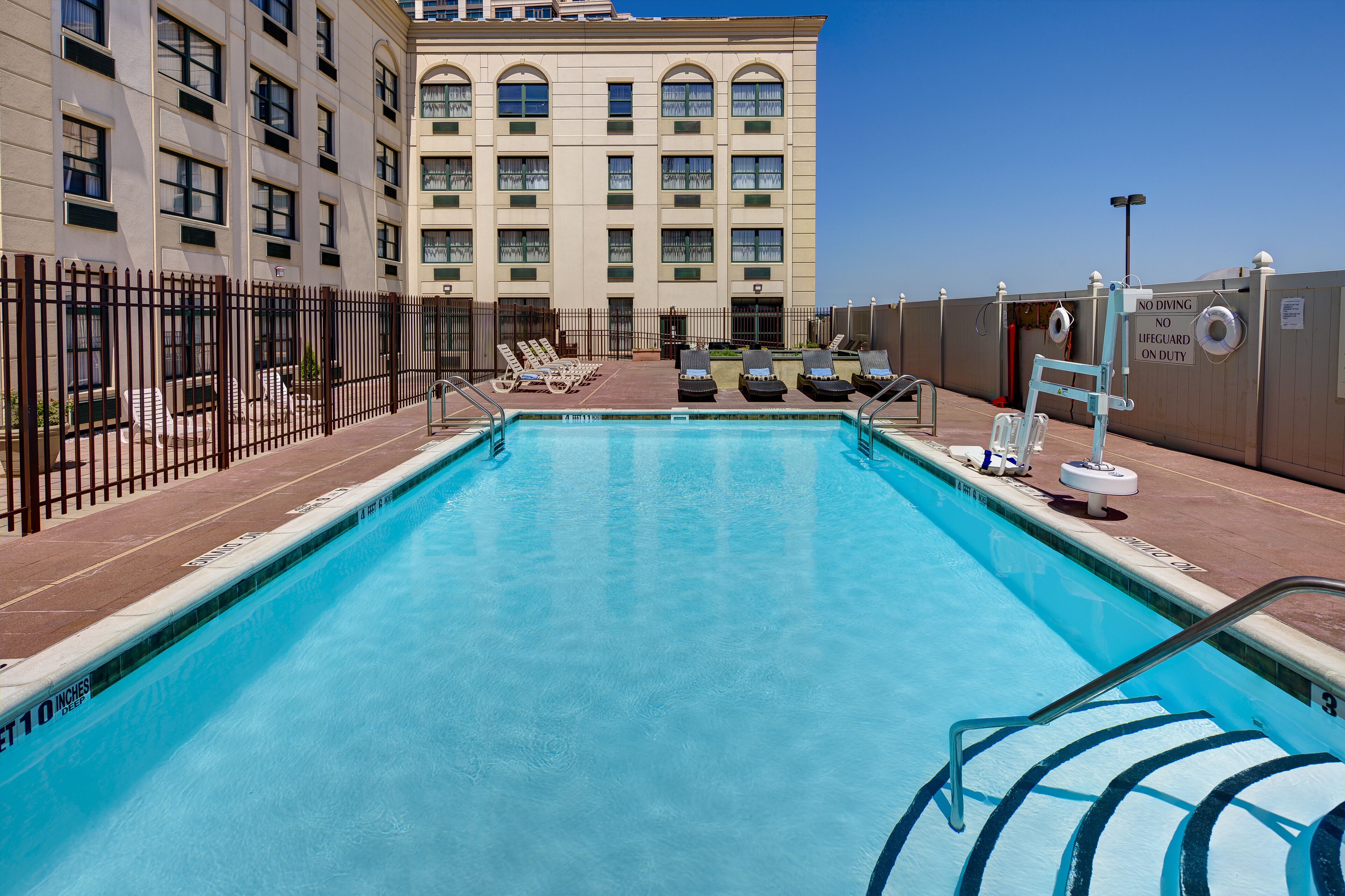 seasonal outdoor pool, open 9 am to 7:00 pm, pool loungers