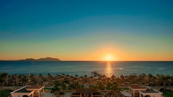 4 outdoor pools, open 7:00 AM to 6:00 PM, pool umbrellas, sun loungers