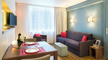 Apartment, 1 Bedroom | Living area | Flat-screen TV