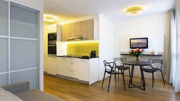 1-Bedroom Eiffel Tower View | Living room | Flat-screen TV