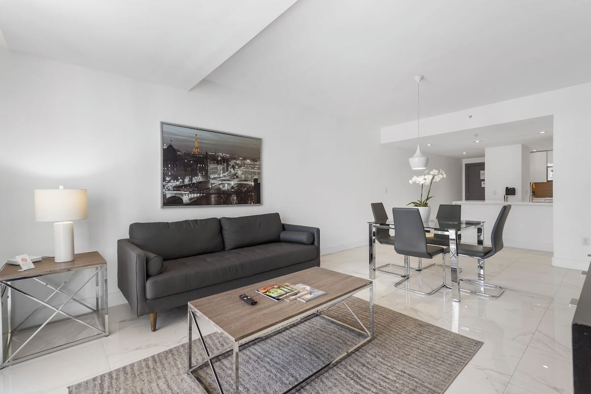 Luxury Two Bedroom Suite with Balcony | Living area | 42-inch TV with cable channels