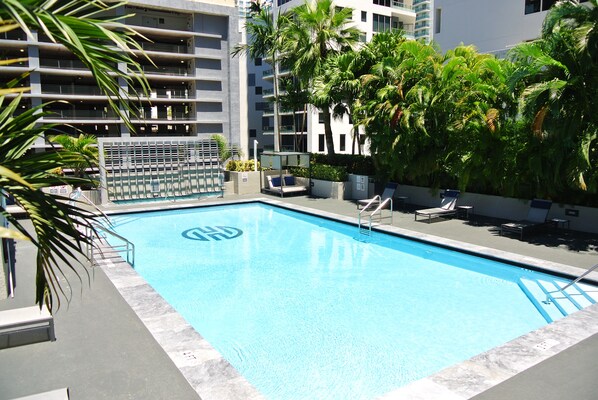 Outdoor pool, open 7:00 AM to 6:00 PM, sun loungers