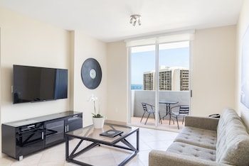 Standard Two Bedroom Suite with Balcony & Waterview | Living area | 42-inch TV with cable channels at Fortune House Hotel Suites