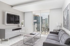 Luxury Two Bedroom Suite with Balcony | Living area | 42-inch TV with cable channels