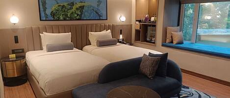 Premium bedding, memory-foam beds, minibar, in-room safe