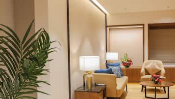 Premium Suite | Living area | 32-inch LCD TV with satellite channels, TV