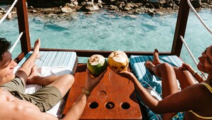 A wooden deck with a view of the ocean and rocky shoreline. - Hard Rock Hotel Riviera Maya -  All Inclusive (Puerto Aventuras)