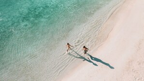 An aerial view of a beach with clear turquoise water and white sand. - Hard Rock Hotel Riviera Maya -  All Inclusive (Puerto Aventuras)