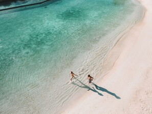 Private beach, white sand, beach umbrellas, beach towels