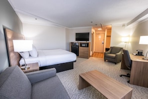 Standard Suite, 1 King Bed, Non Smoking | Desk, laptop workspace, blackout drapes, iron/ironing board