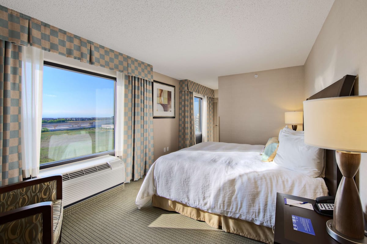 King Evolution Suite | Premium bedding, Select Comfort beds, desk, blackout drapes
