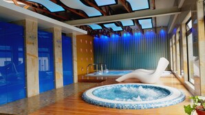 A modern spa area with a hot tub, wooden flooring, and blue lockers. - Bogota Plaza Hotel  (Bogotá)