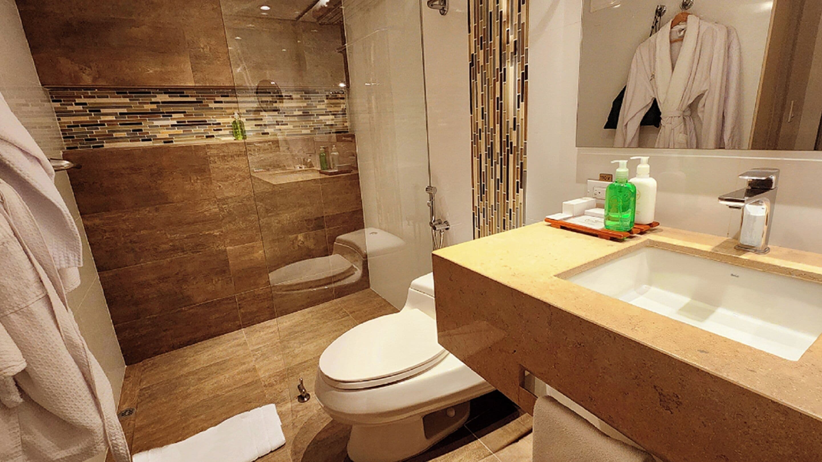 executive room, 1 king bed | bathroom | free toiletries, hair dryer, slippers, towels