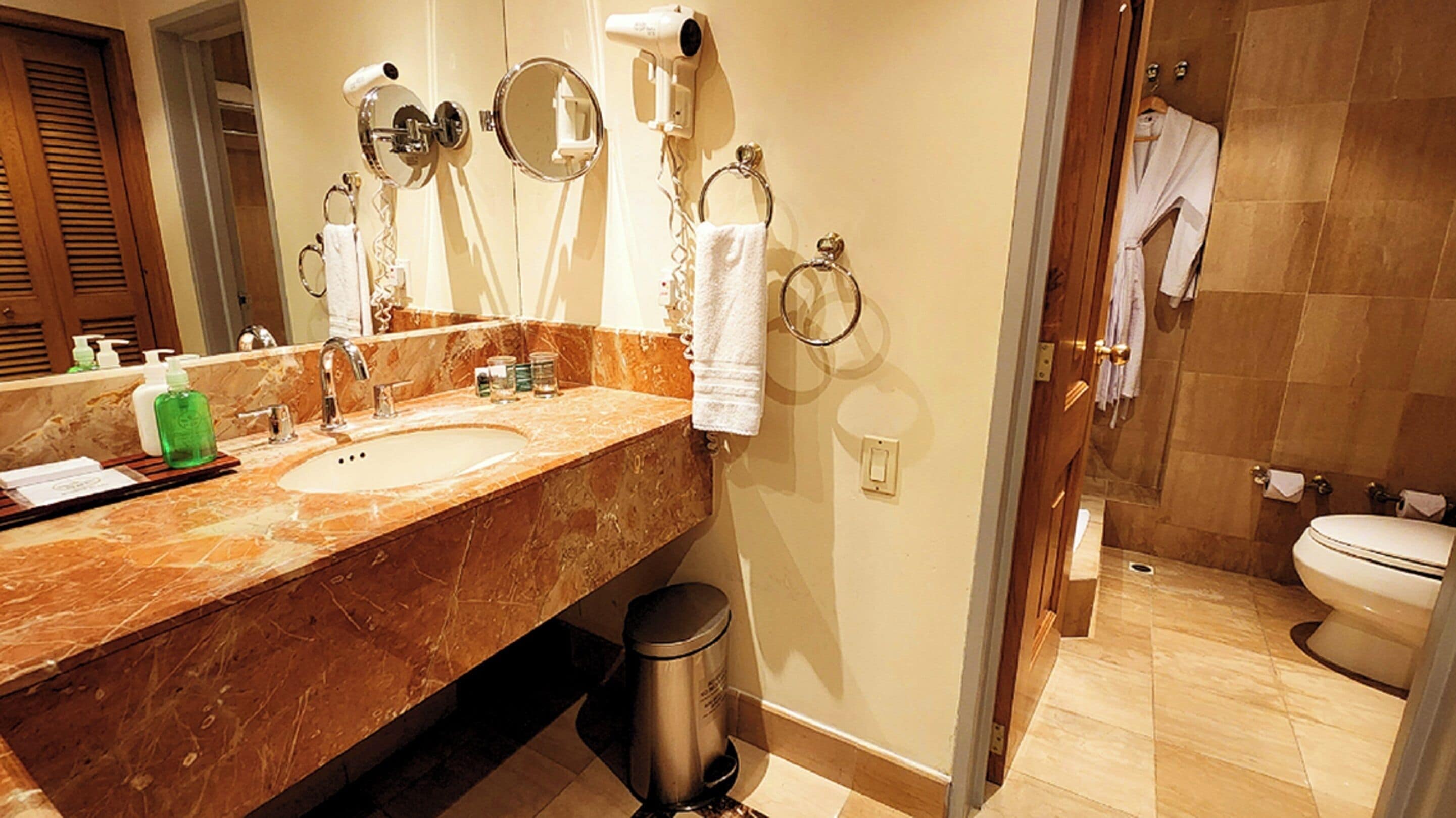 deluxe room, 1 king bed | bathroom | free toiletries, hair dryer, slippers, towels