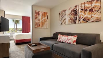 Suite, 1 King Bed | Living area | 19-inch flat-screen TV with cable channels, TV