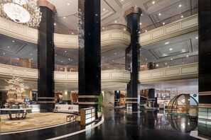 Experience the grandeur of our lobby, featuring a stunning chandelier, multiple levels, and a welcoming reception area.