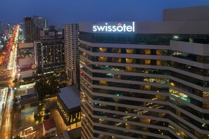 Swissotel offers a sleek, city-view facade.