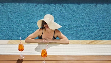 Outdoor pool, open 6:00 AM to 10:00 PM, free cabanas, sun loungers