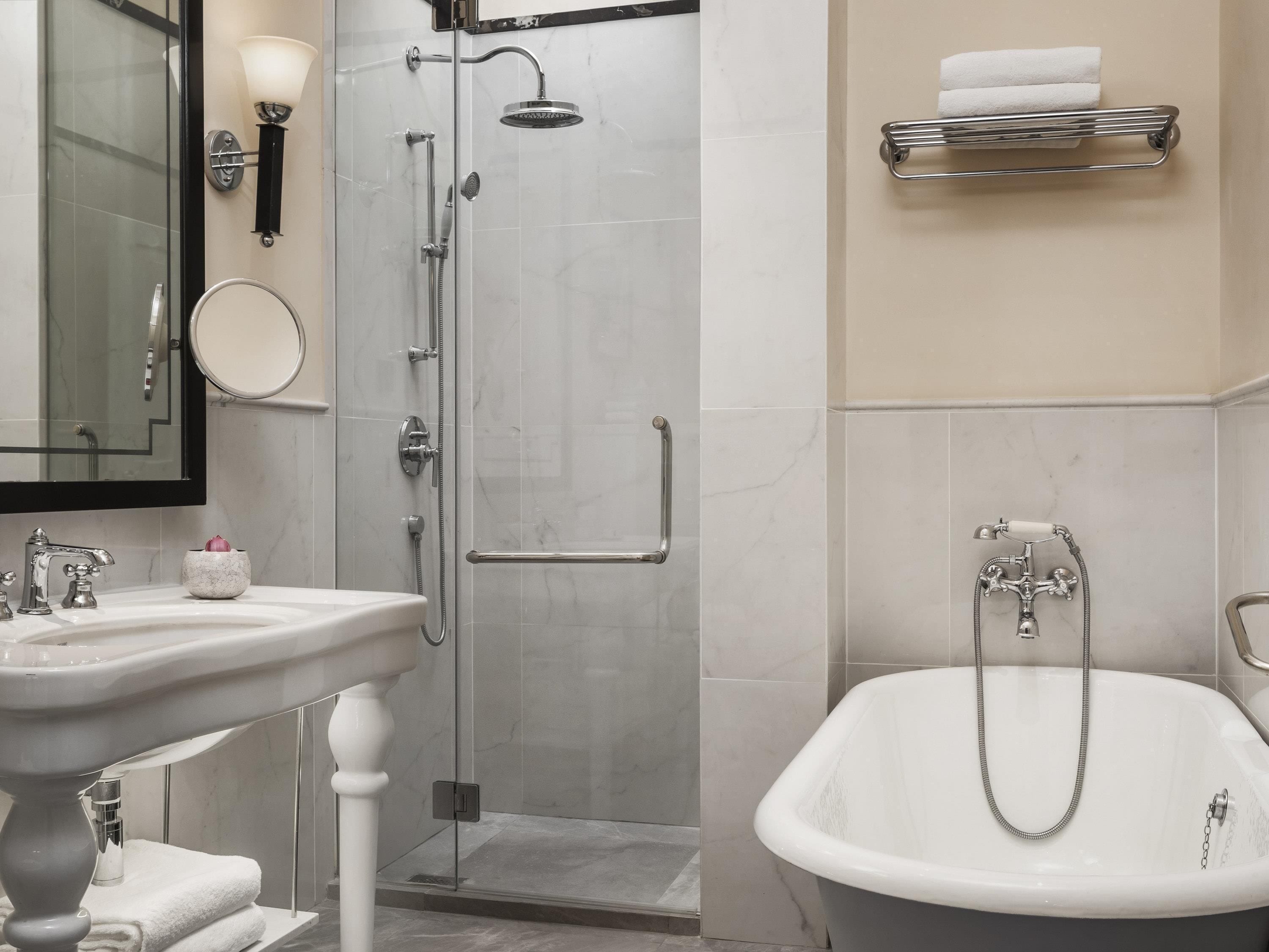Separate tub and shower, rainfall showerhead, eco-friendly toiletries