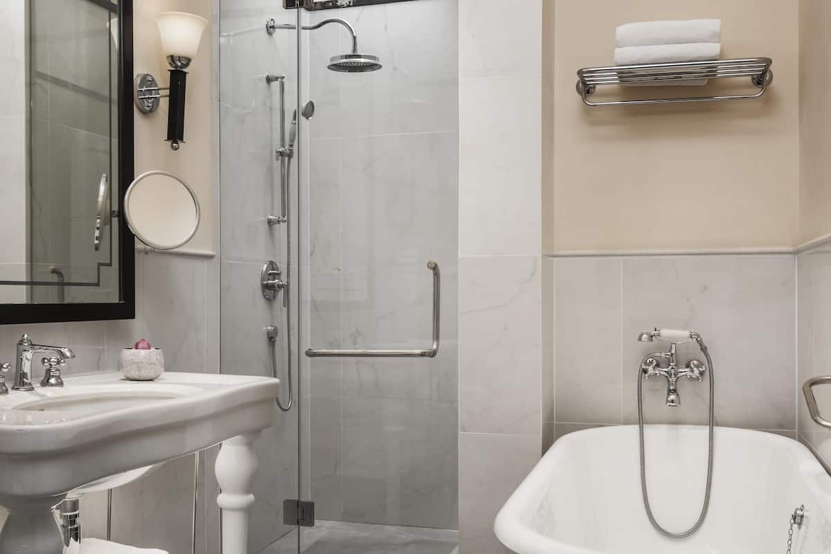 Separate tub and shower, rainfall showerhead, eco-friendly toiletries
