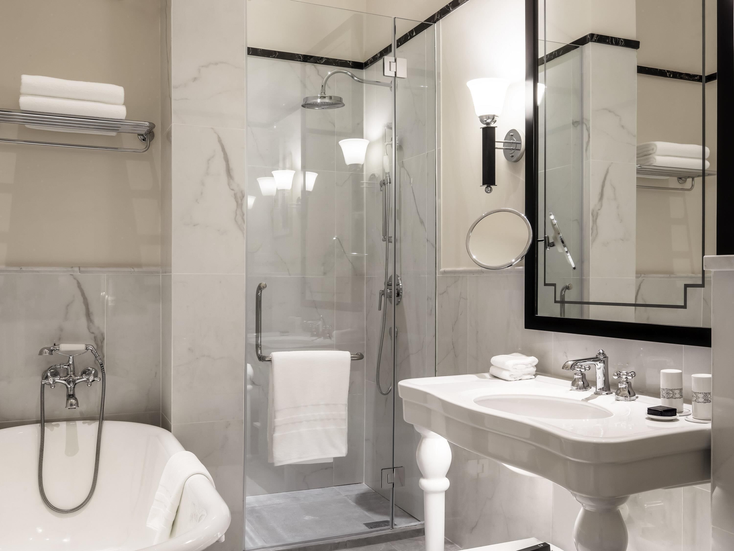 Separate tub and shower, rainfall showerhead, eco-friendly toiletries